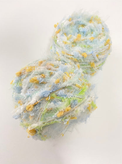 Daisy Chain yarn with white yellow blue and green pastel colors